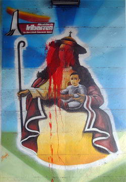 Tres murales de la Divina Pastora fueron manchados de rojo.
